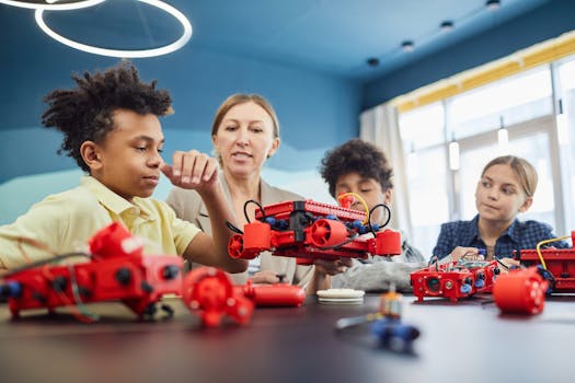 Young students and teacher collaborating on a robotics project in a classroom setting.